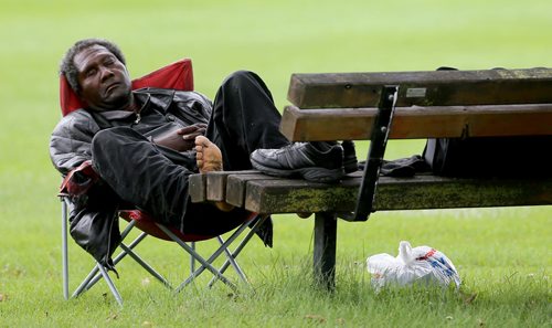 A man naps in Assiniboine Park, Saturday, September 5, 2015. (TREVOR HAGAN/WINNIPEG FREE PRESS)