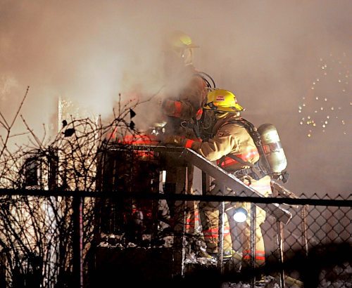 BORIS MINKEVICH / WINNIPEG FREE PRESS  071217 Fire crews work on a house fire in the 400 block of Furby.