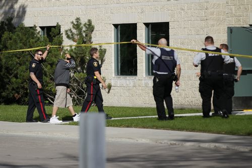 September 6, 2015 - 150906 -  Police escort an unidentified male into a Health Sciences Centre building. Winnipeg Police and emergency personnel were called to the Health Sciences Centre Sunday, September 6, 2015. John Woods / Winnipeg Free Press