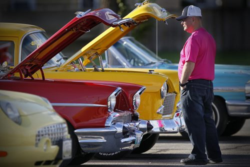 September 6, 2015 - 150906 -  People look at the engines of old cars at the Grant Park Shopping Centre Sunday, September 6, 2015. John Woods / Winnipeg Free Press