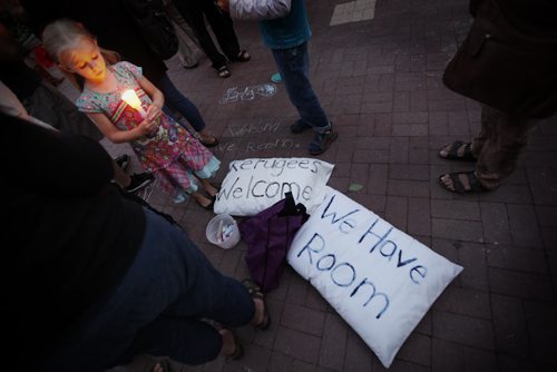 September 6, 2015 - 150906 -  People gathered at Winnipeg's city hall for a demonstration and a vigil for dead and missing refugees Sunday, September 6, 2015. John Woods / Winnipeg Free Press