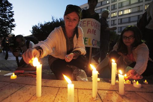 September 6, 2015 - 150906 -  People gathered at Winnipeg's city hall for a demonstration and a vigil for dead and missing refugees Sunday, September 6, 2015. John Woods / Winnipeg Free Press