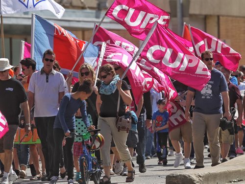 Participants in the Labour Day March make their way along Memorial Boulevard Monday afternoon.   150907 September 07, 2015 MIKE DEAL / WINNIPEG FREE PRESS