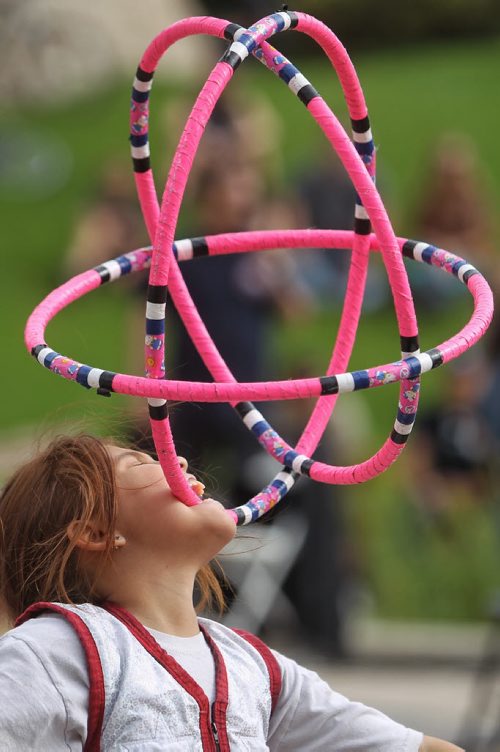 Callie Starr, 9, performs during a hoop dance at a pow wow at the Oodena circle in The Forks Monday afternoon.  150907 September 07, 2015 MIKE DEAL / WINNIPEG FREE PRESS