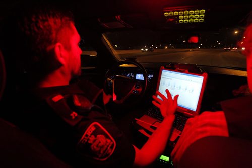 Police ride along curfew checks. Based out of east district police station, on Dugald Road.  In this photo Constable Cal Bailey in the cruiser. BORIS MINKEVICH / WINNIPEG FREE PRESS PHOTO Sept. 3, 2015