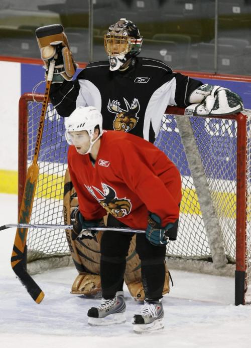 John Woods / Winnipeg Free Press / December 18/07- 071218  - Manitoba Moose Drew MacIntyre and Ryan Shannon wait for the next drill at practice Tuesday December 18, 2007.