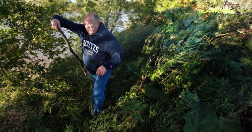 Wayne Gacek beat the bushes along the Red River near Whittier Park Tuesday evening, searching for his dear friend Jill Tardiff. Recently released from hospital Jill went missing early Monday morning. See shley Prest story. September 8, 2015 - (Phil Hossack / Winnipeg Free Press)