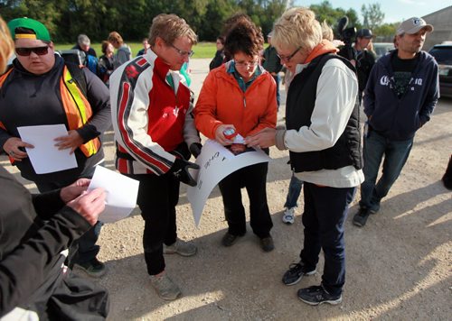 Friends, family and volunteers prepare to search in and around Whittier Park Tuesday evening, searching for  Jill Tardiff. Recently released from hospital Jill went missing early Monday morning. See Ashley Prest story. September 8, 2015 - (Phil Hossack / Winnipeg Free Press)