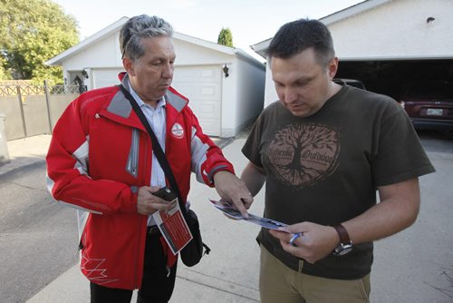 September 8, 2015 - 150908 - Liberal candidate Dan Vandel (L) talks with resident Remi Jobin as he door knocks in his St Boniface/St Vital riding Tuesday, September 8, 2015. John Woods / Winnipeg Free Press