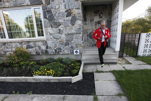 September 8, 2015 - 150908 - Liberal candidate Dan Vandel leaves a home after getting no answer as he door knocks in his St Boniface/St Vital riding Tuesday, September 8, 2015. John Woods / Winnipeg Free Press