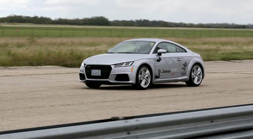 David Richert, a professional racecar driver pilots an Audi TT around the Gimli Motorsports Park, during a fundraising event involving Winnipeg Jets' Mark Scheifele and Michael Hutchinson, for KidSport Winnipeg, Thursday, September 10, 2015. (TREVOR HAGAN/WINNIPEG FREE PRESS)