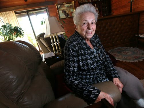Dr. Alicja Kuffel poses in her Springfield home,   she fled Poland in 1940 at the age of 14 with her mom and sister when the Soviets invaded and empathizes with the refugee moms and kids she sees fleeing from Syria. For Saturday Special by Sanders September 11, 2015 - (Phil Hossack / Winnipeg Free Press) SEE RELEASE?