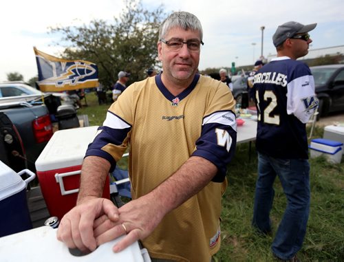 Rick Robitaille, tailgating with friends, prior to the Banjo Bowl, Saturday, September 12, 2015. (TREVOR HAGAN/WINNIPEG FREE PRESS)
