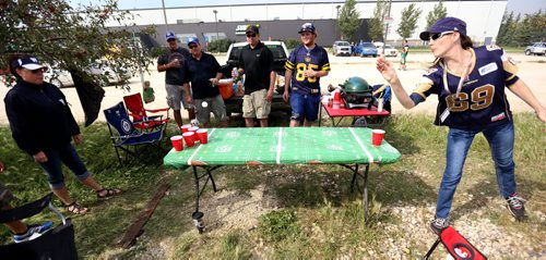 Jacquie Colbeck, right, playing beer pong prior to the Banjo Bowl, Saturday, September 12, 2015. (TREVOR HAGAN/WINNIPEG FREE PRESS)