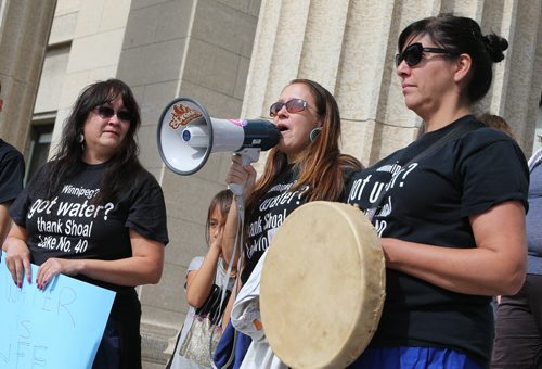 Shoal Lake 40 First Nation member Sharon Redsky speaks as Several hundred people took part in the Winnipeg Water Walk in support of Shoal Lake 40 First Nation on Sept. 12, 2015. The event began behind the Legislative building and the group marched down Broadway to the Canadian Museum for Human Rights. Photo by Jason Halstead/Winnipeg Free Press