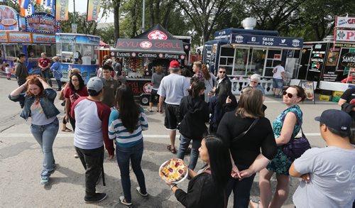 Crowds line up for food trucks at Manyfest on Broadway on Sept. 12, 2015. Photo by Jason Halstead/Winnipeg Free Press