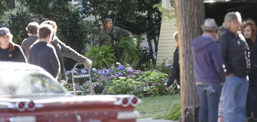 Plants are moved to set the scene in front of a home on Baltimore Rd. in Riverview Monday during the making of the movie A Dog's Purpose with Dennis Quaid.  Randall King story.  Wayne Glowacki / Winnipeg Free Press September 14 2015