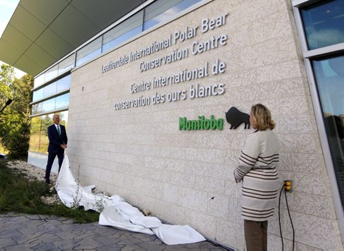 Doug and Louise Leatherdale have donated $2 million to the zoo's polar bear exhibit. It will be called the Leatherdale International Polar Bear Conservation Centre. In this photo left to right Assiniboine Park Conservancy chairman Hartley Richardson and Louise Leatherdale unveil the new name on the centre. BORIS MINKEVICH / WINNIPEG FREE PRESS PHOTO Sept. 14, 2015