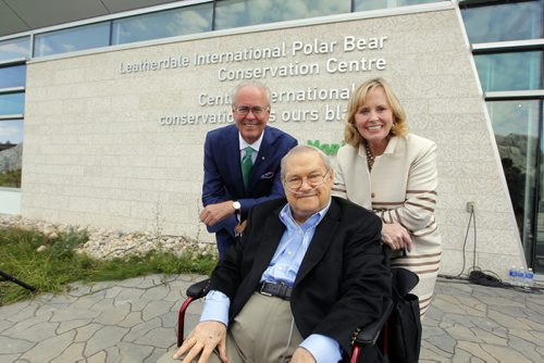 Doug and Louise Leatherdale have donated $2 million to the zoo's polar bear exhibit. It will be called the Leatherdale International Polar Bear Conservation Centre. In this photo left to right Assiniboine Park Conservancy chairman Hartley Richardson and Doug and Louise Leatherdalein front of the centre with the new name on it. BORIS MINKEVICH / WINNIPEG FREE PRESS PHOTO Sept. 14, 2015
