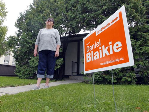 George Suttie Bay resident Jean Shewchuk is proud to have a NDP Daniel Blaikie sign on her lawn.  BORIS MINKEVICH / WINNIPEG FREE PRESS PHOTO Sept. 15, 2015