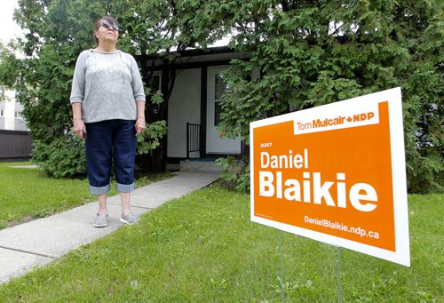 George Suttie Bay resident Jean Shewchuk is proud to have a NDP Daniel Blaikie sign on her lawn.  BORIS MINKEVICH / WINNIPEG FREE PRESS PHOTO Sept. 15, 2015