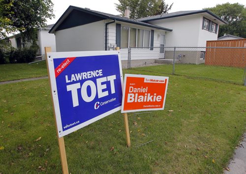 NDP Daniel Blaikie and Lawrence Toet signs in Transcona. The Erickson household has both signs on it as the father and son are voting for different candidates. BORIS MINKEVICH / WINNIPEG FREE PRESS PHOTO Sept. 15, 2015