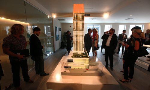 Guests gather around a scale model of SkyCity Centre at a preview event for an advance opportunity to experience the space, view the scale mode, tour the model suite, view floorplans and suite offerings, meet the team behind this landmark project and experience what living Life Elevated at SkyCity will mean to downtown Winnipeg. See story.   September 15, 2015 - (Phil Hossack / Winnipeg Free Press)