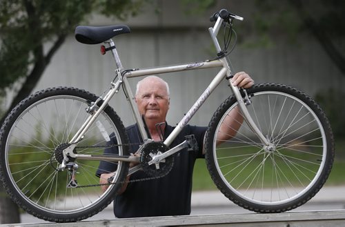 Randy Burkett with his stolen bike that he bought back for $70 on Kijiji  from the person he believes was the thief. Gord Sinclair story Wayne Glowacki / Winnipeg Free Press September 16 2015