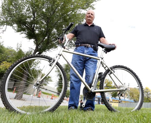 Randy Burkett with his stolen bike that he bought back for $70 on Kijiji  from the person he believes was the thief. Gord Sinclair story Wayne Glowacki / Winnipeg Free Press September 16 2015