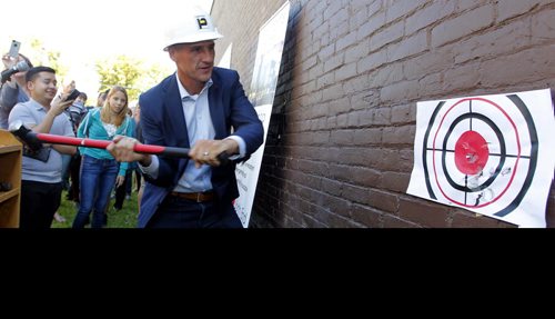 LOCAL - MERCHANTS HOTEL,  541 Selkirk Ave - Merchants Corner community event. The first sledgehammer swings at the old Merchants Hotel which is being transformed into an educational and affordable housing complex. MLA Kevin Chief gets a chance to smash the wall. BORIS MINKEVICH / WINNIPEG FREE PRESS PHOTO Sept. 16, 2015