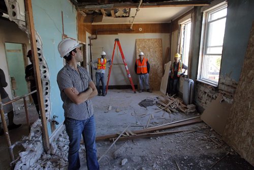 LOCAL - MERCHANTS HOTEL,  541 Selkirk Ave - Merchants Corner community event. The first sledgehammer swings at the old Merchants Hotel which is being transformed into an educational and affordable housing complex. The third floor under demolition. Some workers take a break while the media comes through. BORIS MINKEVICH / WINNIPEG FREE PRESS PHOTO Sept. 16, 2015