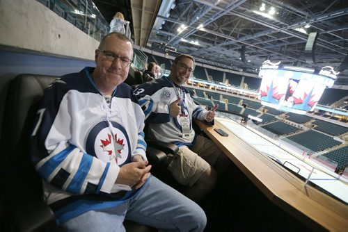Jets season ticket holders Brian Lundeen (left) and Jeremie Robin check out their new loge seats at the MTS Centre. The upgrades are part of $12 million of building enhancements. The Winnipeg Jets showed off the upgrades on Sept. 16, 2015. Photo by Jason Halstead/Winnipeg Free Press