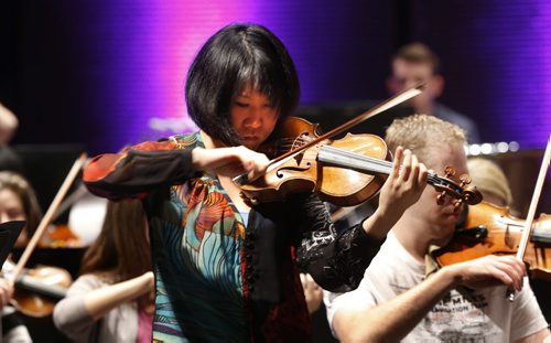 Guest violinist Tianwa Yang rehearses Paganini's Violin Concerto, a violin high-wire act with the Winnipeg Symphony Orchestra Friday morning for the WSO's 68th season opening concert at the Centennial Concert Hall Friday evening. This year also marks Principal Conductor Alexander Mickelthwate's 10th anniversary season with the WSO.  Wayne Glowacki / Winnipeg Free Press September 18 2015