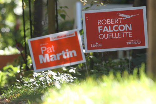 Pat Martin and Robert Falcon Quellette Elections signs stand next to each other on front lawns throughout the Wolsely area (this one shot on Sherburn south of Portage) Friday.  See To go with MA's election story and streeter photos.  Sept 18, 2015 Ruth Bonneville / Winnipeg Free Press
