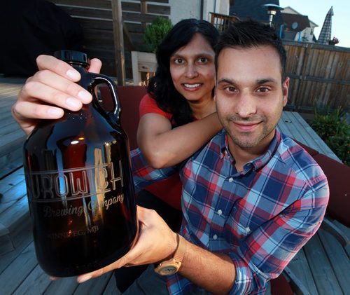 INTERSECTION - Daivin and Leah Macdonald, owner sof North City Growlers, make personalized beer growlers, which have has shipped all over the world, as far as Norway and Hawaii. They come in two sizes, and in glass, ceramic or stainless steel. (Manitoba liquor marts only use glass ones, which is why he started an on-line biz - now most of his sales are outside the province...) Dave Sanderson Story. September 18, 2015 - (Phil Hossack / Winnipeg Free Press)