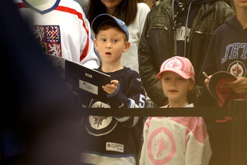 Young Winnipeg  Jets fan, Kyran Broughton 7yrs, waits patiently to get his autograph book signed by players  at the Jets Fanfare at MTS Iceples Saturday. Standup Sept 18, 2015   Ruth Bonneville /Winnipeg Free Press