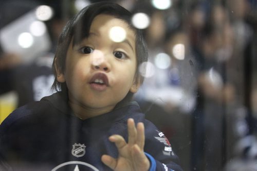 Blake Campos 3yrs, leans up against the glass to see the Jets practice on the ice at Iceplex  during the annual Jets Fanfare Saturday. Standup Sept 18, 2015   Ruth Bonneville /Winnipeg Free Press