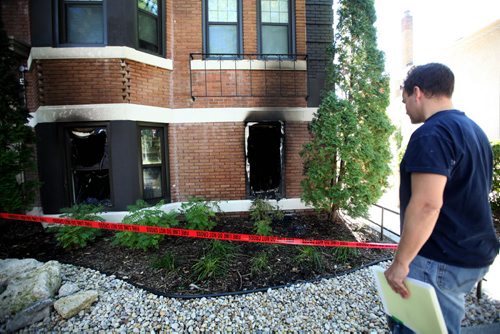 A fire inspector looks over the damage caused by a fire that destroyed a suite in an apartment block at 508 McMillan Ave. Saturday morning.  No injuries were reported.   Sept 18, 2015   Ruth Bonneville /Winnipeg Free Press