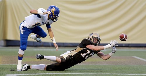 University of British Columbia Thunderbirds' Stavros Katsantonis (18), breaks up a pass in the end zone, intended for University of Manitoba Bisons' Bryden Bone (16) during the first half of their game, Saturday, September 19, 2015. (TREVOR HAGAN/WINNIPEG FREE PRESS)