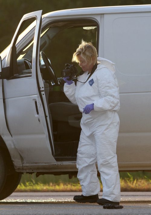 RCMP forensics officer gathers evidence at the scene of a police shooting on Hyw 59 at Kirkness Road Monday morning- Breaking News- See Carol Sanders story- Sept 21, 2015   (JOE BRYKSA / WINNIPEG FREE PRESS)