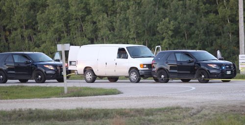 RCMP forensics officer gathers evidence at the scene of a police shooting on Hyw 59 at Kirkness Road Monday morning- Breaking News- See Carol Sanders story- Sept 21, 2015   (JOE BRYKSA / WINNIPEG FREE PRESS)