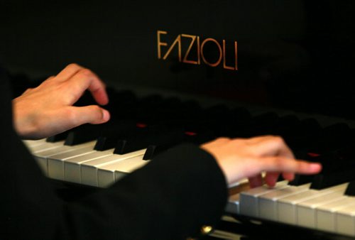 Ten yr old Sarah plays her new Fazoli piano. Most people have never heard of piano brand Fazioli before, but for a pianist  its like hearing the name Ferrari, or Lamborghini. They are regarded today as being the finest pianos ever made  and this is the first one ever to come to Winnipeg. Chick Corea and Herbie Hancock have both signed the harp inside the instrument. (so I gues it's "used". Holly Harris story.  SEPTEMBER 21, 2015 - (PHIL HOSSACK / WINNIPEG FREE PRESS)