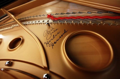 Ten yr old Sarah plays her new Fazoli piano. Most people have never heard of piano brand Fazioli before, but for a pianist  its like hearing the name Ferrari, or Lamborghini. They are regarded today as being the finest pianos ever made  and this is the first one ever to come to Winnipeg. Chick Corea and Herbie Hancock have both signed the harp inside the instrument. (so I gues it's "used". Holly Harris story.  SEPTEMBER 21, 2015 - (PHIL HOSSACK / WINNIPEG FREE PRESS)