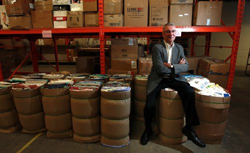 Robert Granke Canadian Lutheran World Relief exec director poses in their warehouse with much needed supplies to be shipped to  Syrian refugees in Jordan.  For Sanders story about response to feds weekend news that Canada is welcoming more Syrian refugees. SEPTEMBER 21, 2015 - (PHIL HOSSACK / WINNIPEG FREE PRESS)