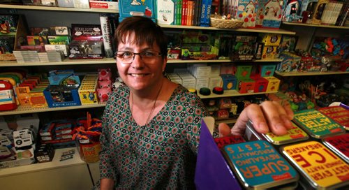 Toad Hall Toys owner KARI ENGLAND poses in her store for a story on how the declining value of the Canadian dollar is driving up the price of some of the toys in her Exchange District store. See Murray McNeill's story. September 22,2015 - (PHIL HOSSACK / WINNIPEG FREE PRESS)