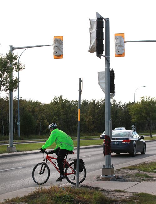 New traffic light installation on Grant ave will provide safer crossing at the Assinaboine FOrrest for cyclists and pedestrians. September 22,2015 - (PHIL HOSSACK / WINNIPEG FREE PRESS)