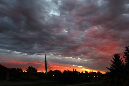 Pre dawn light illuminates the clouds over the Esplanade Riel Pedestrian Bridge Wednesday morning in Winnipeg- See Carol Sanders story- Sept 21, 2015   (JOE BRYKSA / WINNIPEG FREE PRESS)