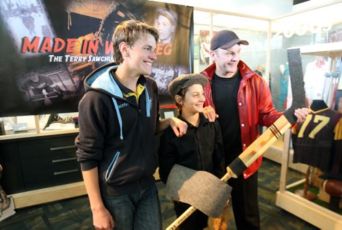 Winnipeg writer/producer/ director, Danny Schur ,right, actors Matthew Lupu (C- playing a young Terry Sawchuk) and Daniel McIntyre-Ridd (L- Playing Terrys older brother) were at the Sport for Life Centre in Winnipeg  today promoting his upcoming Terry Sawchuk docu-drama Winnipeg  The show will make its debut at the Terry Sawchuck Arena - 901 Kimberly  at Sept 26, 2015 at  8 pm it will be free to public  with room for 750 to 800 people- Standup Photo- Sept 23, 2015   (JOE BRYKSA / WINNIPEG FREE PRESS)
