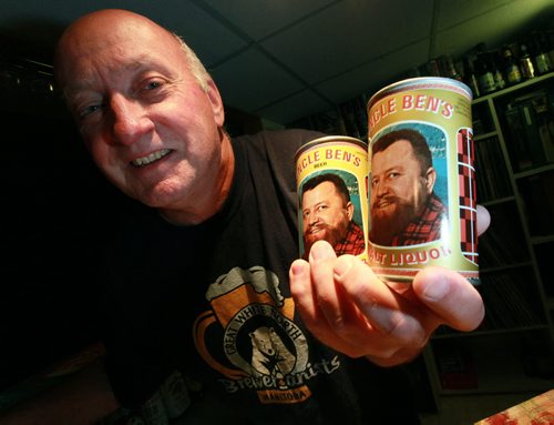 Rob Horwood (holds a pair of Uncle Bens Beer, brewed at one time in Manitoba) is the founder of the Great White North Brewerianists club - the group is hosting its annual show & sale on Oct 3 - we're talking beer cans - Rob has one wall in his basement lined with 100s of cans (all empty, sorry) - even better, the  beer can turns 80 years young this year! So shots of Rob showing off his collection - besides specializing in Canadian cans, he also has an impressive display of Harley-Davidson cans - and binder upon binder of rare beer labels, too... See Dave Sanderson story. September 23, 2015 - (PHIL HOSSACK / WINNIPEG FREE PRESS)