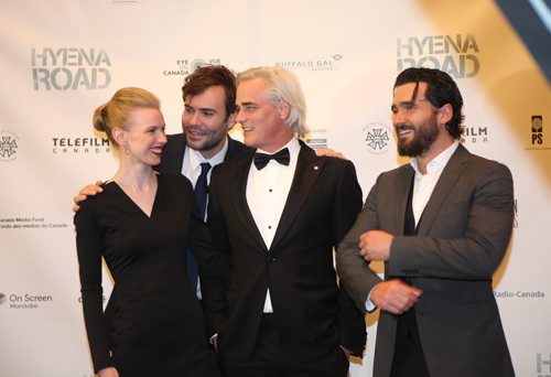 Paul Gross (white hair),  Rossif Sutherland (second from left), Christine Horne (left)  and Allan Hawco (right) the Canadian cast and crew of Hyena Road pose for photos at the Centennial Concert Hall Wednesday evening for an exclusive screening of the show. Sept 23, 2015 Ruth Bonneville / Winnipeg Free Press